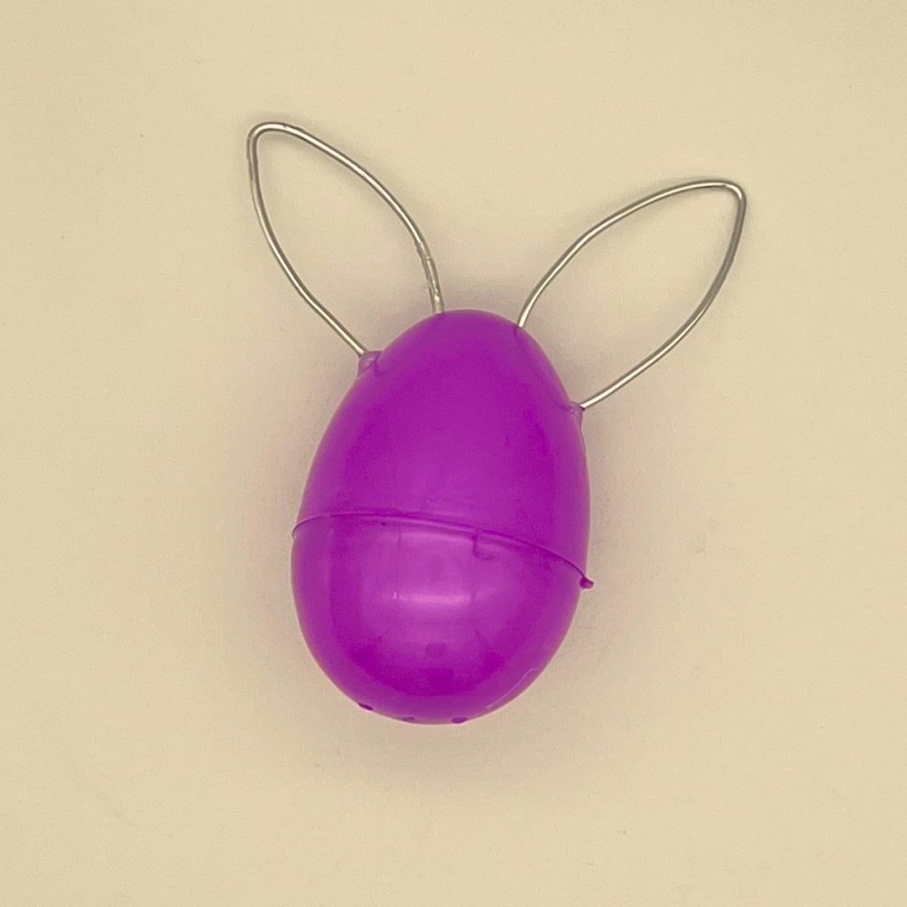 purple plastic easter egg with wire bunny ears