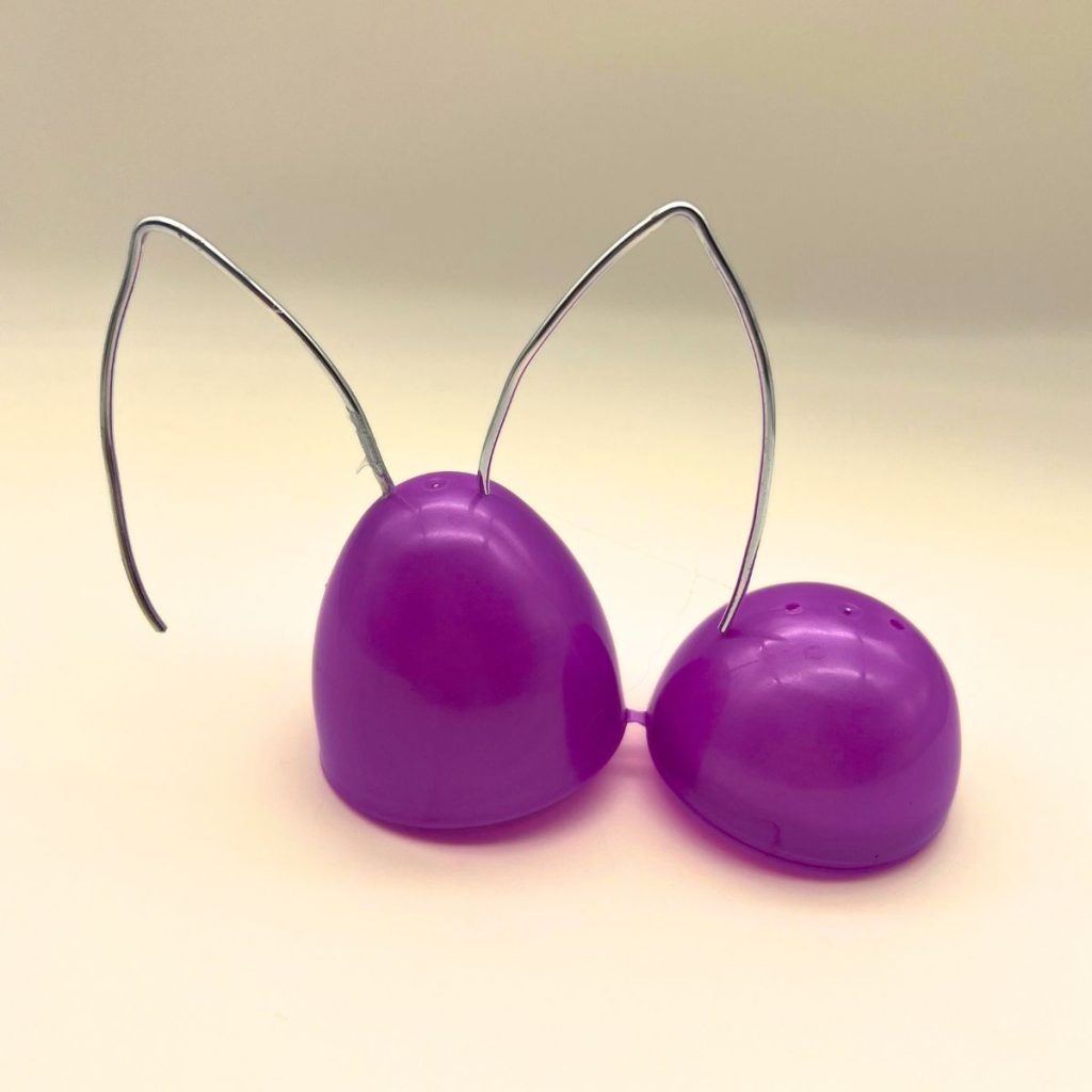 purple plastic easter egg with wire bunny ears