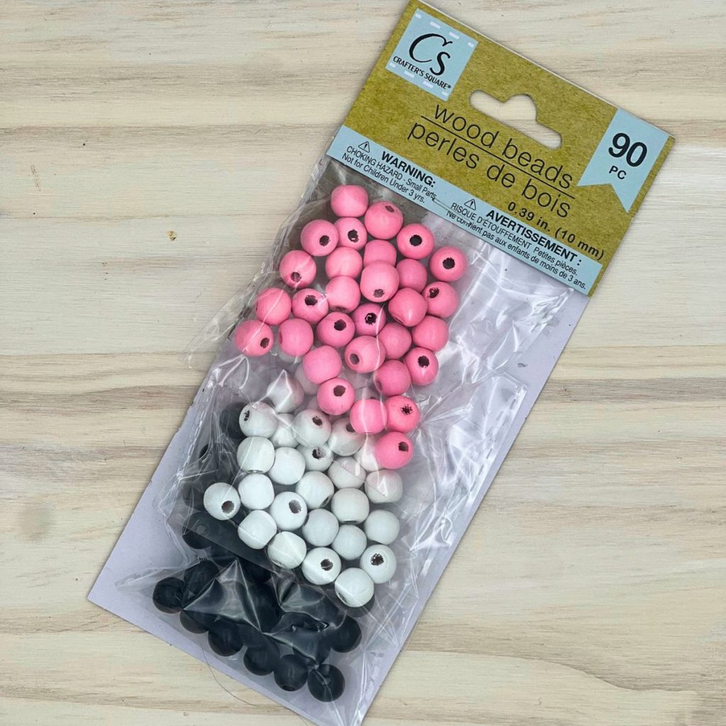 dollar tree beads package in pink white and black